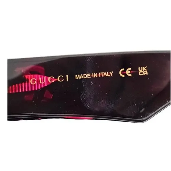 Gucci GG1423O cat-eye eyeglasses in a fuchsia havana color display picture 1